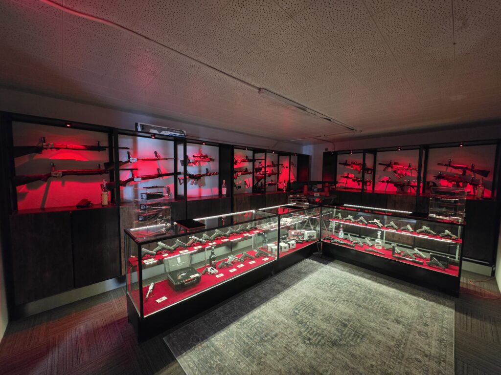 Illuminated firearm display cases inside the shop