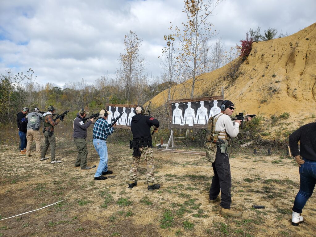 Participants practicing at an outdoor shooting range