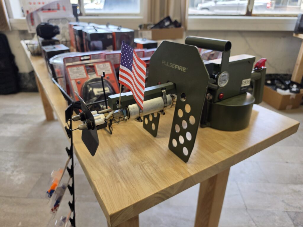 Display firearm on a counter beside ammunition and accessories