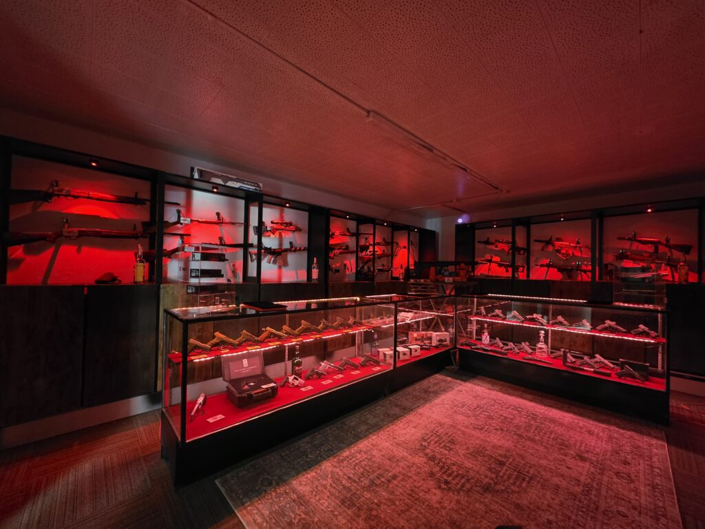 Illuminated firearm display cases inside the shop