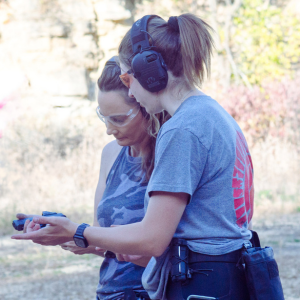 Participant wearing hearing protection during handgun instruction